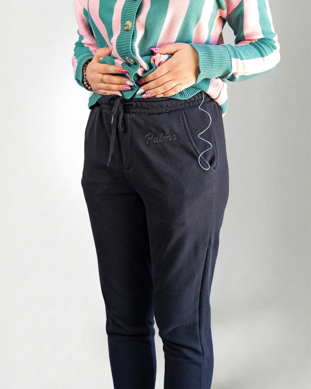 Person black pants on a light gray background