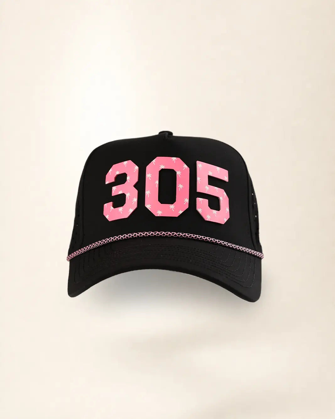 A black trucker-style baseball cap featuring the number '305' in pink with a white star pattern on the front, and a thin pink chain detail across the brim.