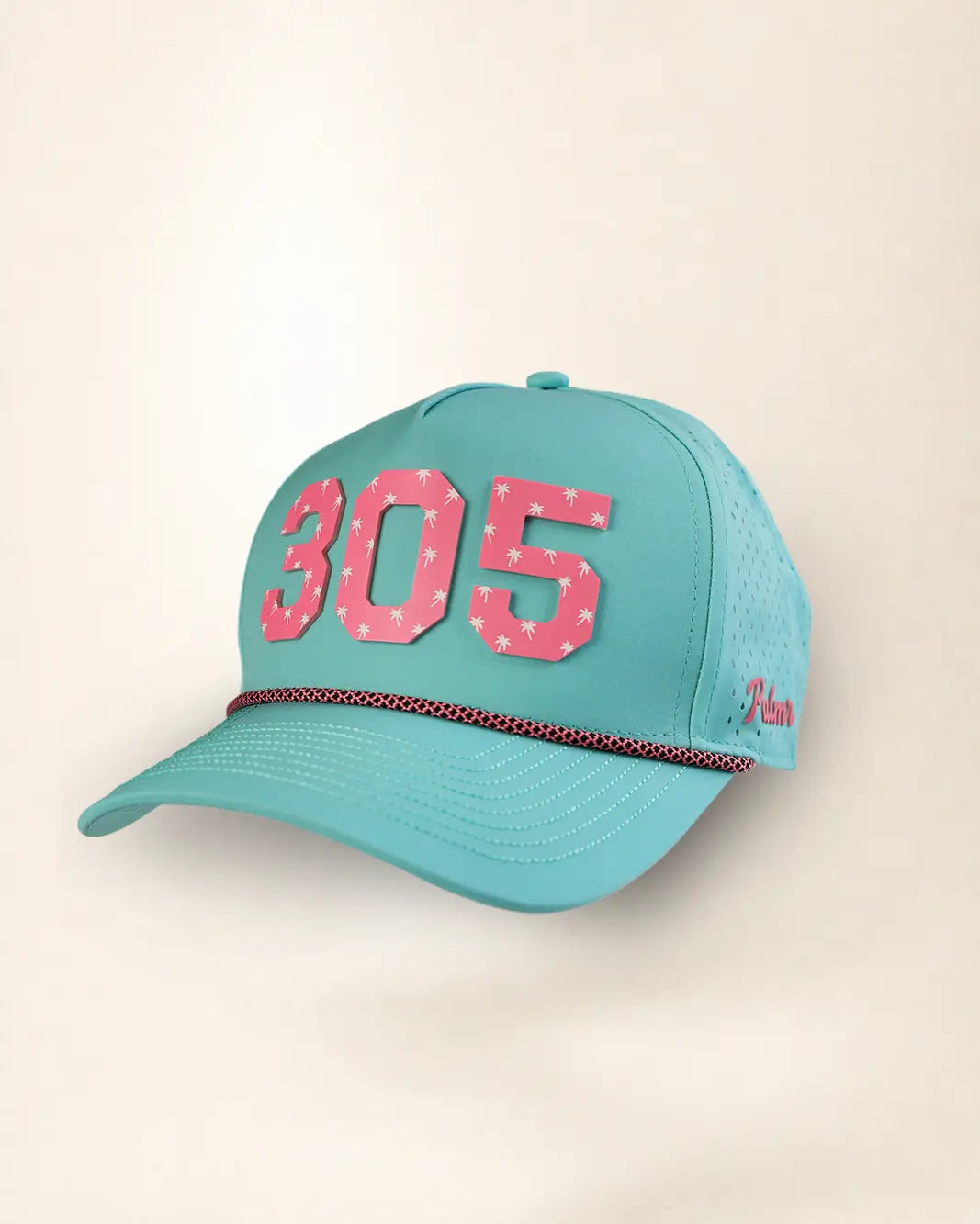 A turquoise baseball cap with pink star-patterned '305' lettering on the front and a thin red-and-white dotted stripe across the brim, shown against a plain light beige background.