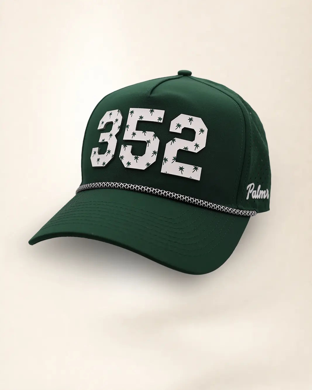 The 352 Signature Hat (Green): dark green rope snapback, white 352 with small green palm trees, black and white braided rope, perforated sides.