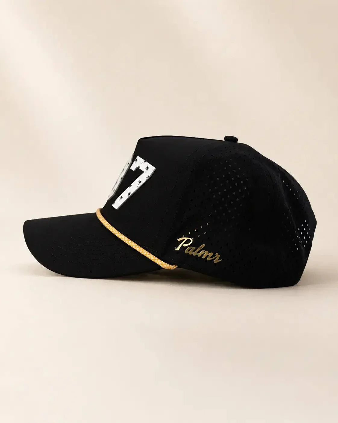 The 407 Hat black and gold with white Orlando area code and gold rope detail