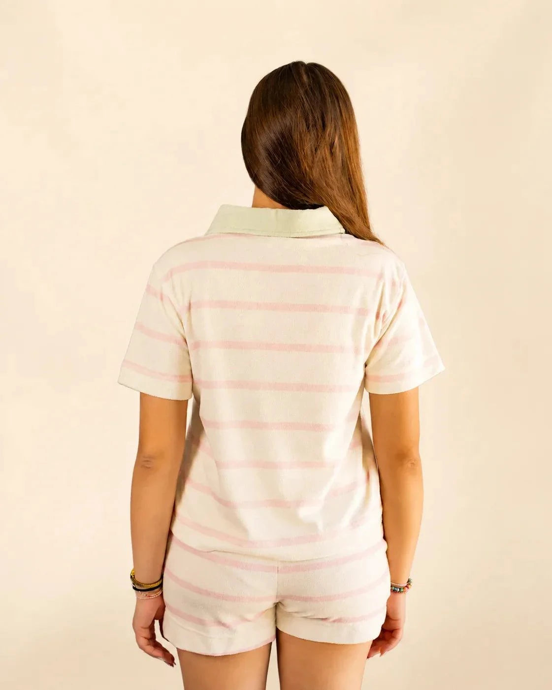 The Cabana Pink Stripe Top in cream with soft pink stripes and a Palm Green collar, made from breathable micro-terry cloth.