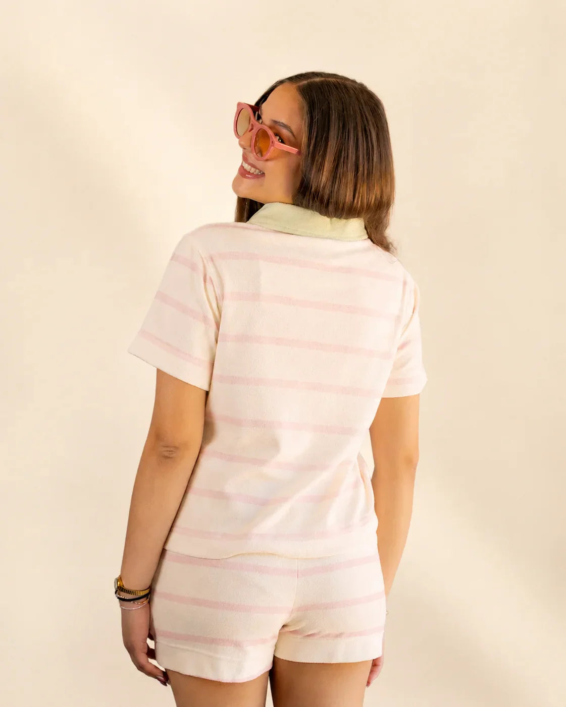 The Cabana Pink Stripe Top in cream with soft pink stripes and a Palm Green collar, made from soft micro-terry cloth for a relaxed fit.