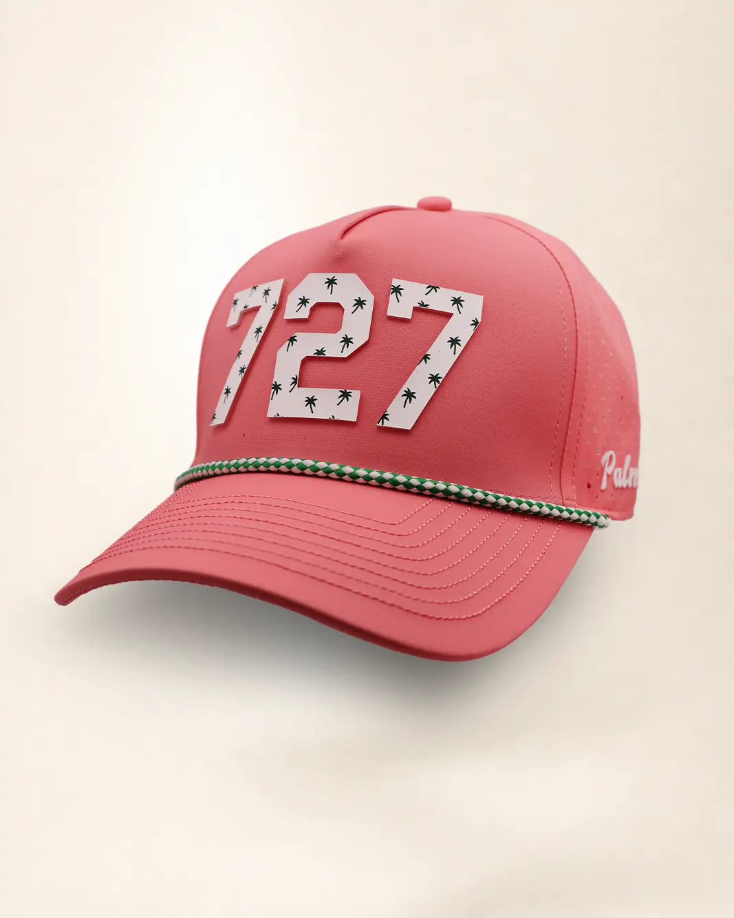 The 727 Signature Hat (Pink), three-quarter view: white raised 727 with small palm print on a pink rope snapback, green and white rope, white Palmr script.