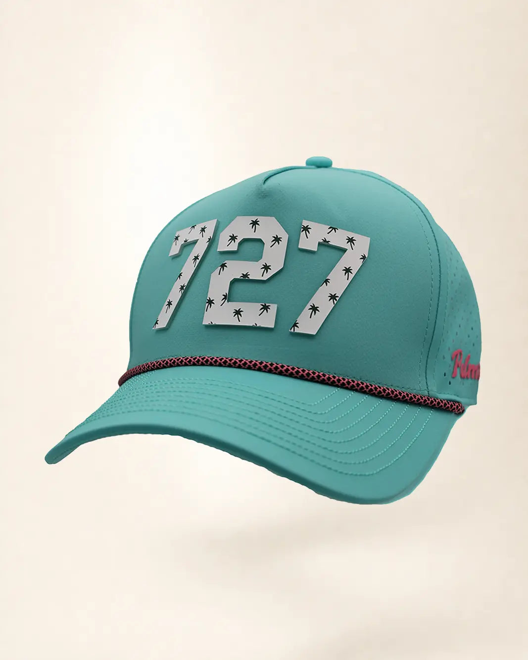 The 727 Signature Hat (Teal), three-quarter view: white raised 727 with small palm print on a teal rope snapback, pink and black rope, pink Palmr script.