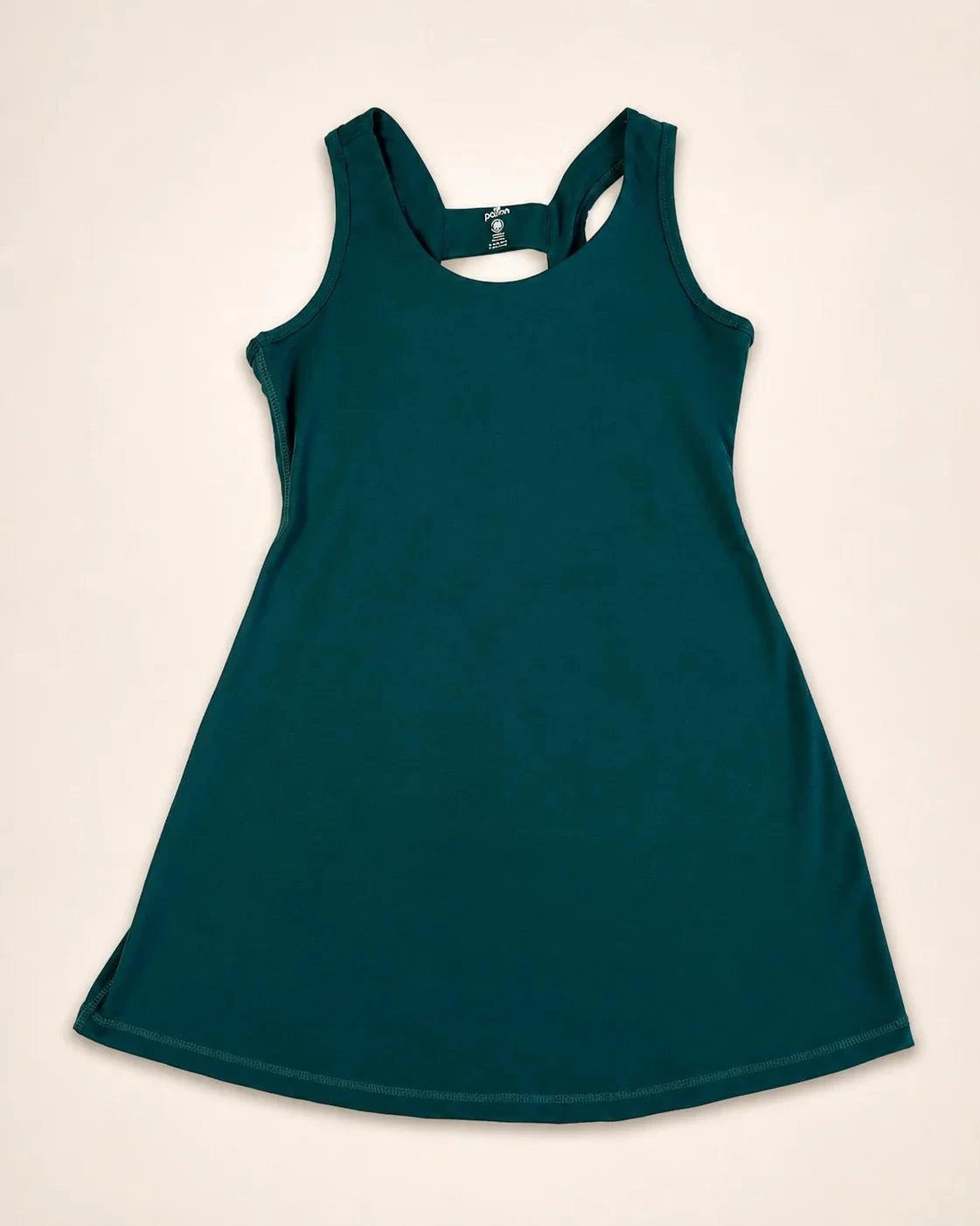 The Ace Dress in palm green with poly-spandex stretch, pockets, and removable bra cups