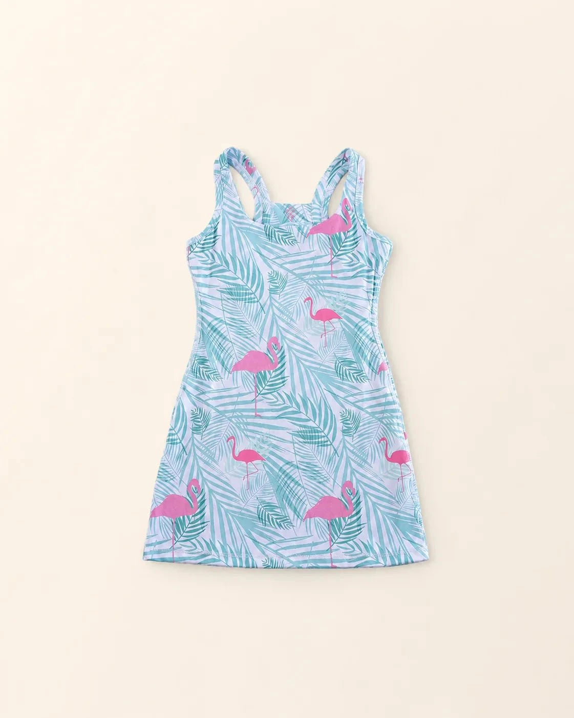 Ace Kids Dress in Island Breeze print with pink flamingos and palm fronds, featuring pump-friendly shorts with pockets and discreet slits for insulin pumps.