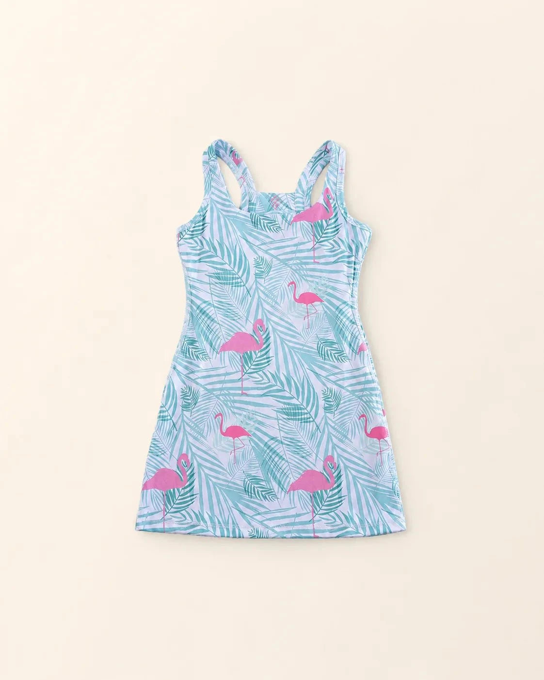 Ace Kids Dress in Island Breeze print with pink flamingos and palm fronds, featuring pump-friendly shorts with pockets and discreet slits for insulin pumps.