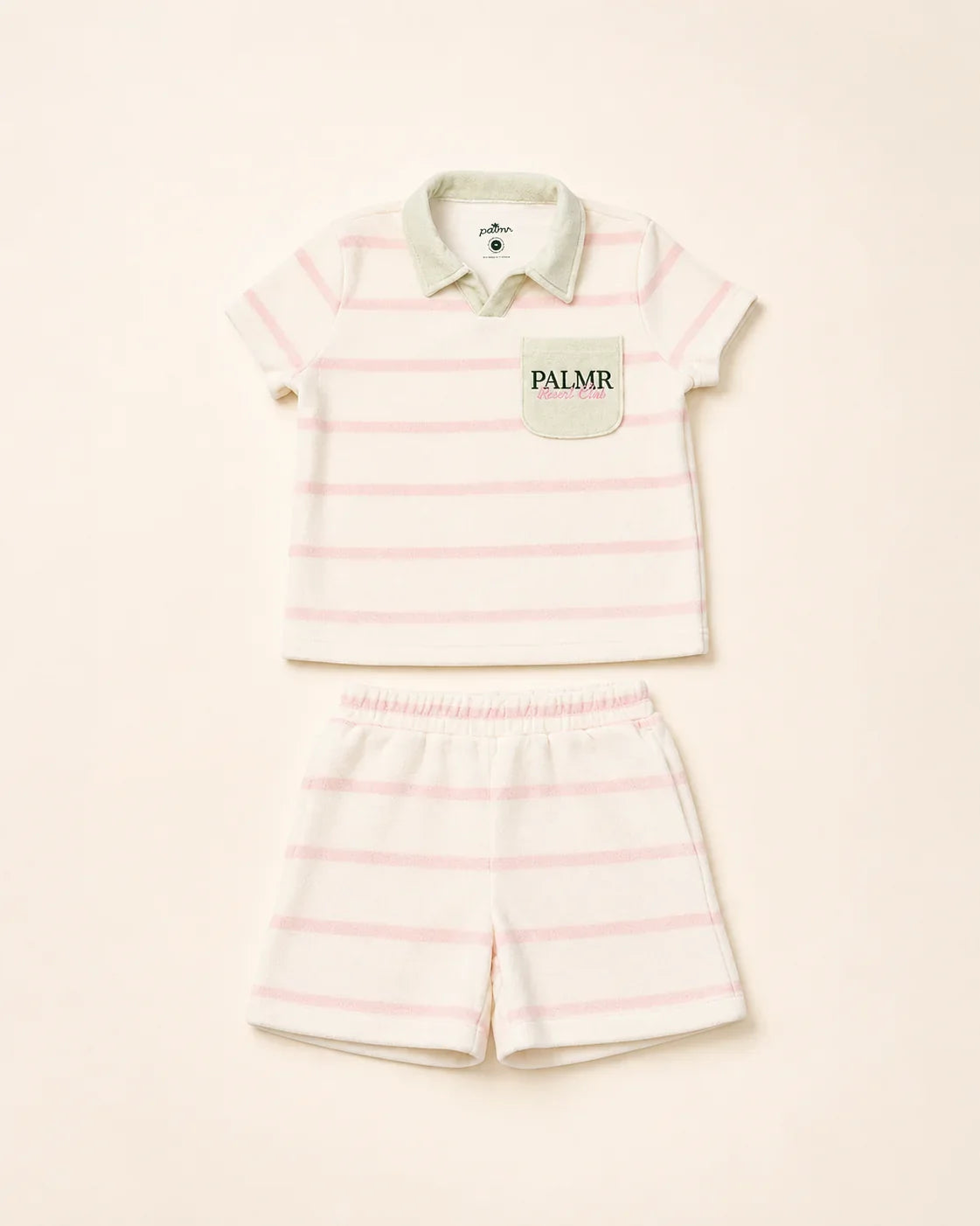 Girl wearing Cabana Pink Stripe top with green collar and pocket in plush micro-terry cloth