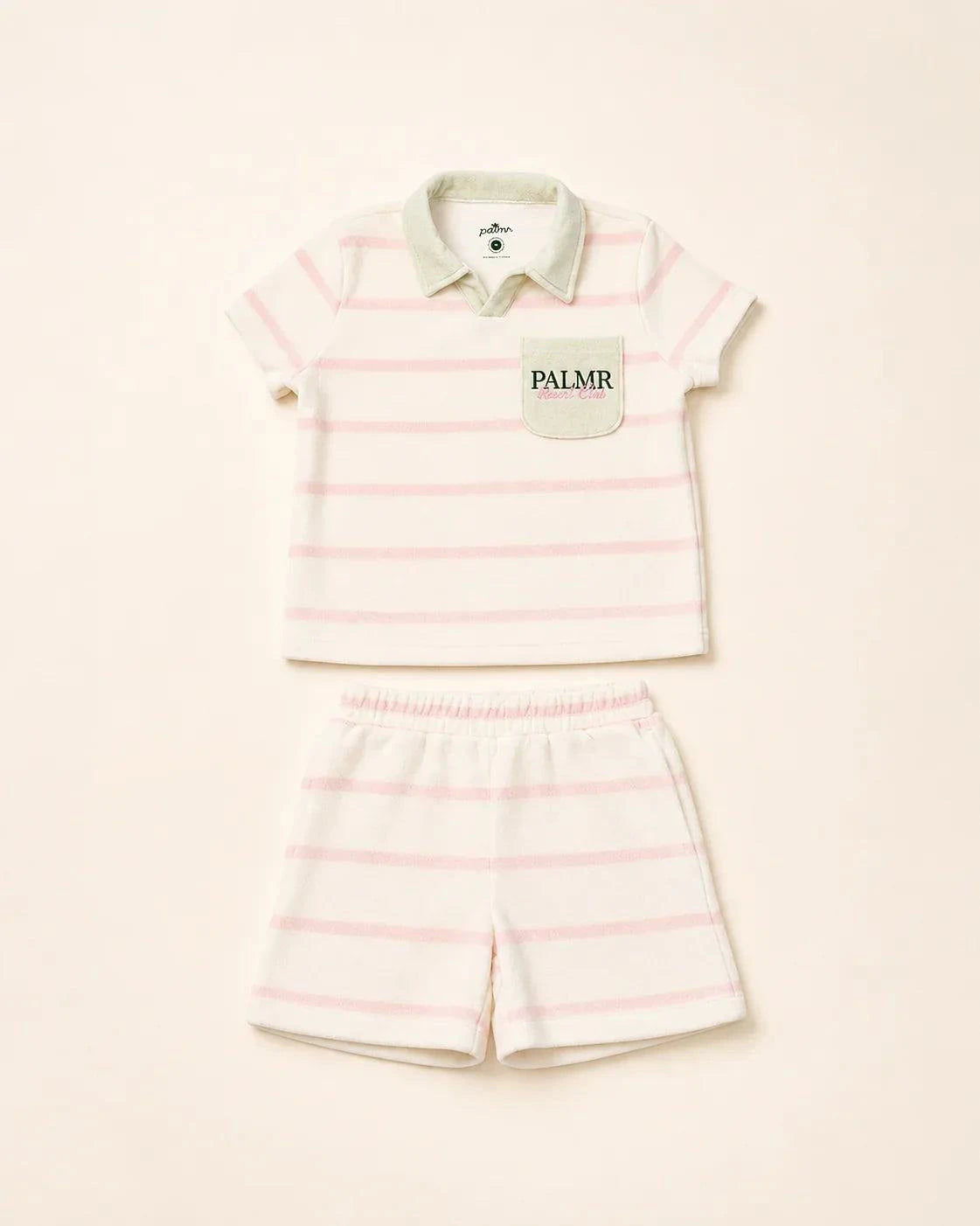 Girl wearing Cabana Pink Stripe top with green collar and pocket in plush micro-terry cloth
