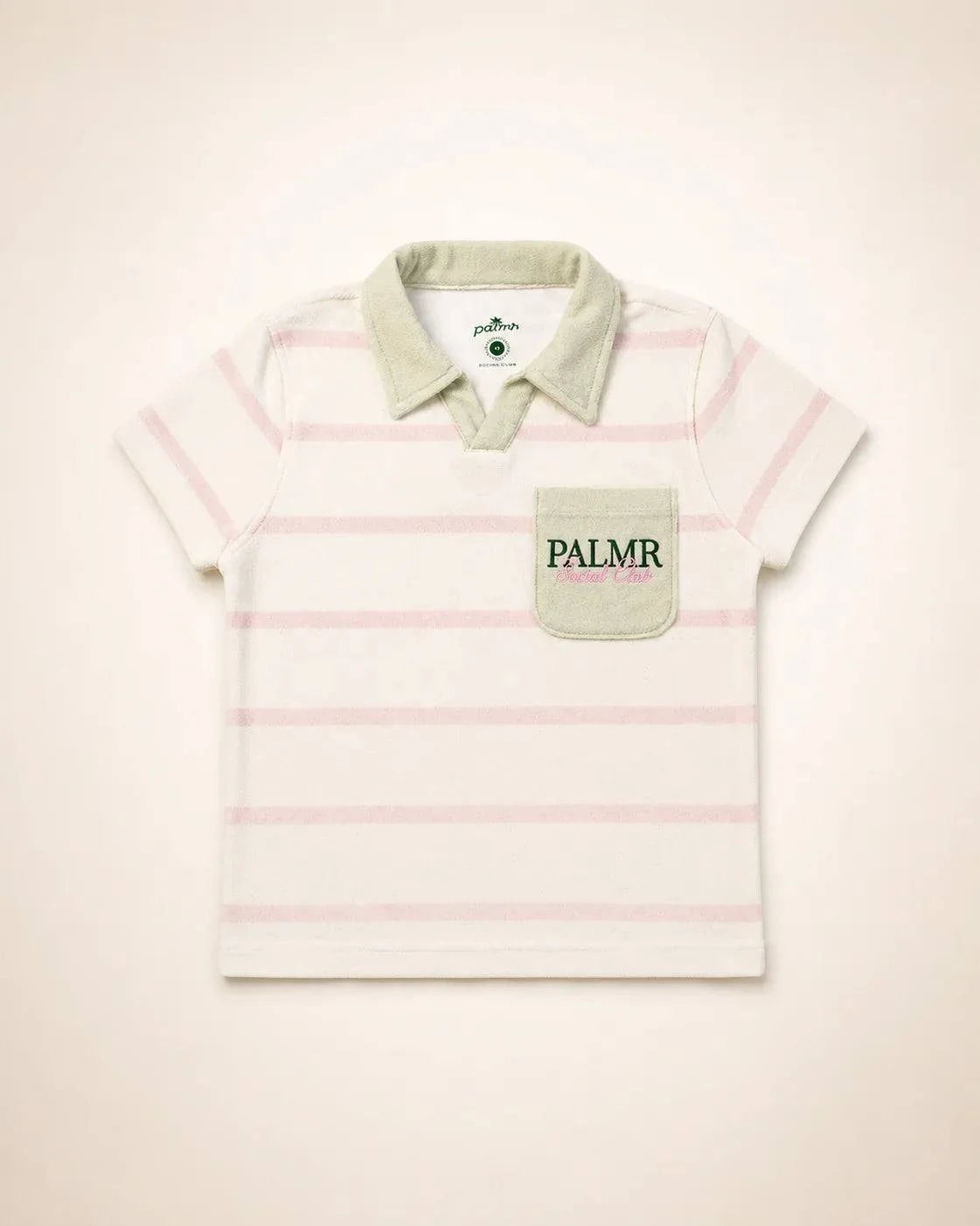 Girl wearing Cabana Pink Stripe top with green collar and pocket