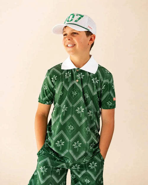 The Club Palm Kids Polo with green geometric palm print and white ribbed collar for active kids