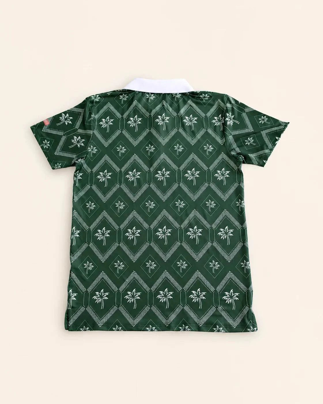 The Club Palm Polo in palm green with geometric diamond and palm tree pattern, white ribbed collar, perfect for casual and clubwear.