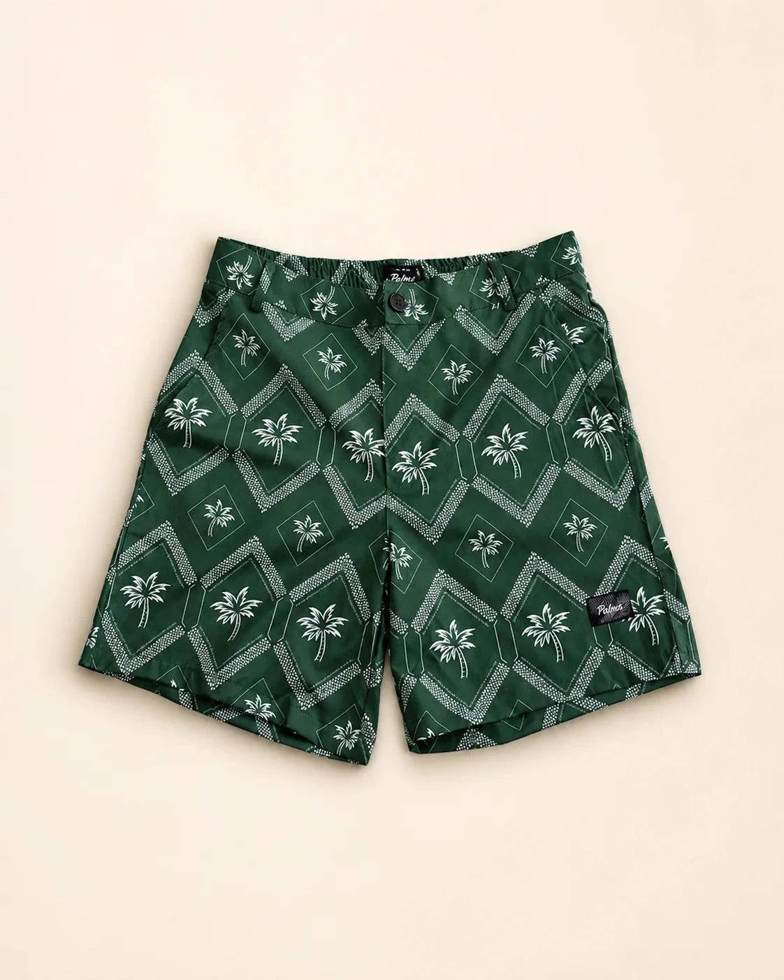 Men wearing The Club Palm Hybrid Swim Shorts with palm tree and geometric diamond print by the pool and patio.