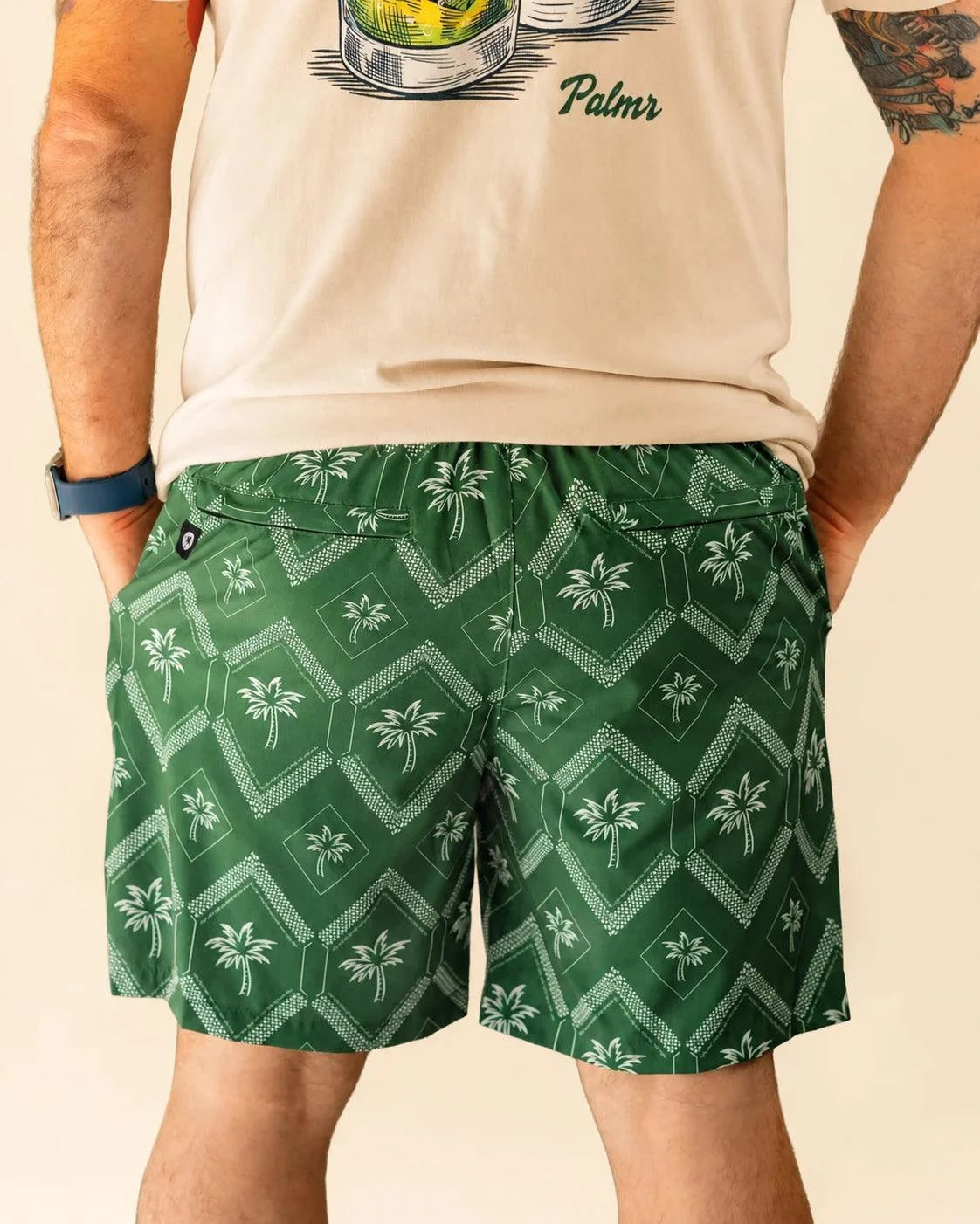 The Club Palm Hybrid Swim Shorts in Palm Green geometric diamond print with zippered pockets for versatile outdoor activities