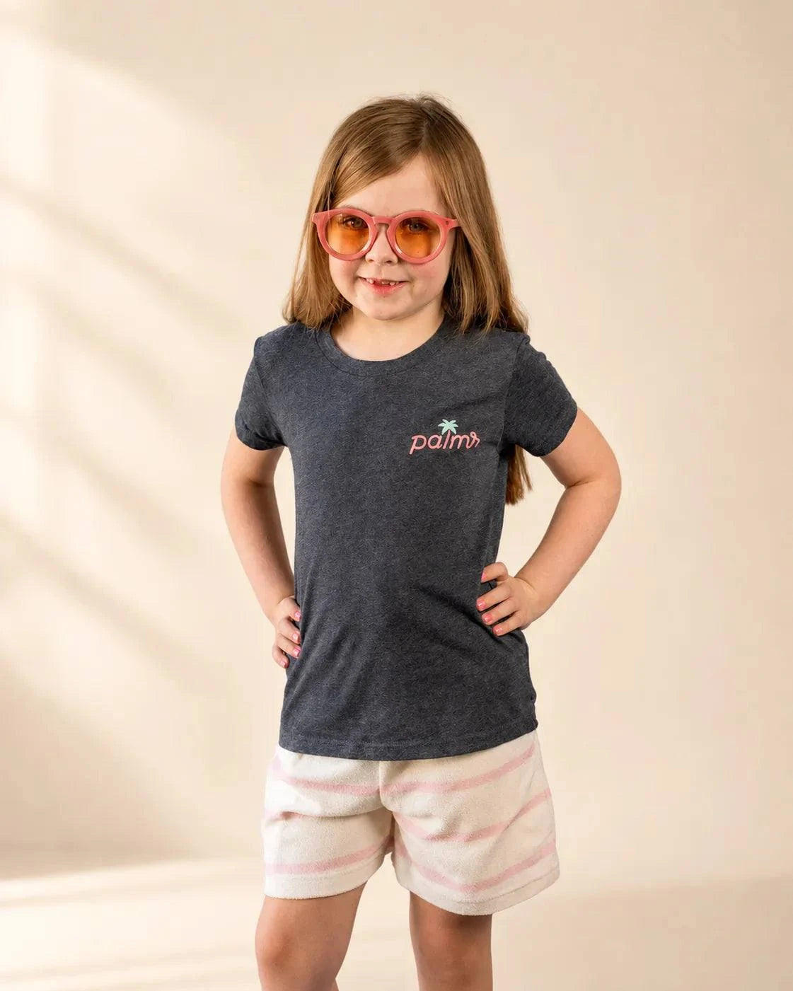 Black mineral wash The Evening Palm Kids Tee with Palmr logo and beach sunset graphic, soft heather cotton-poly blend.