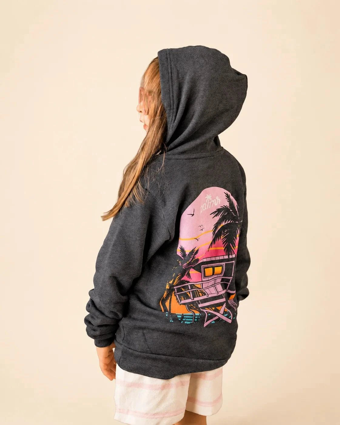 The Evening Palm Kids Hoodie in dark heather grey with sunset graphic on back and Palmr logo on front