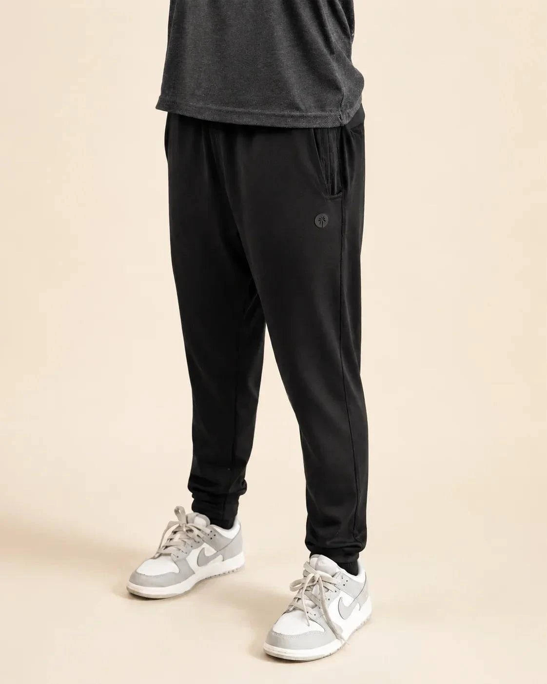 The All-Day Boys Jogger in black with athletic tapered fit and zip pockets