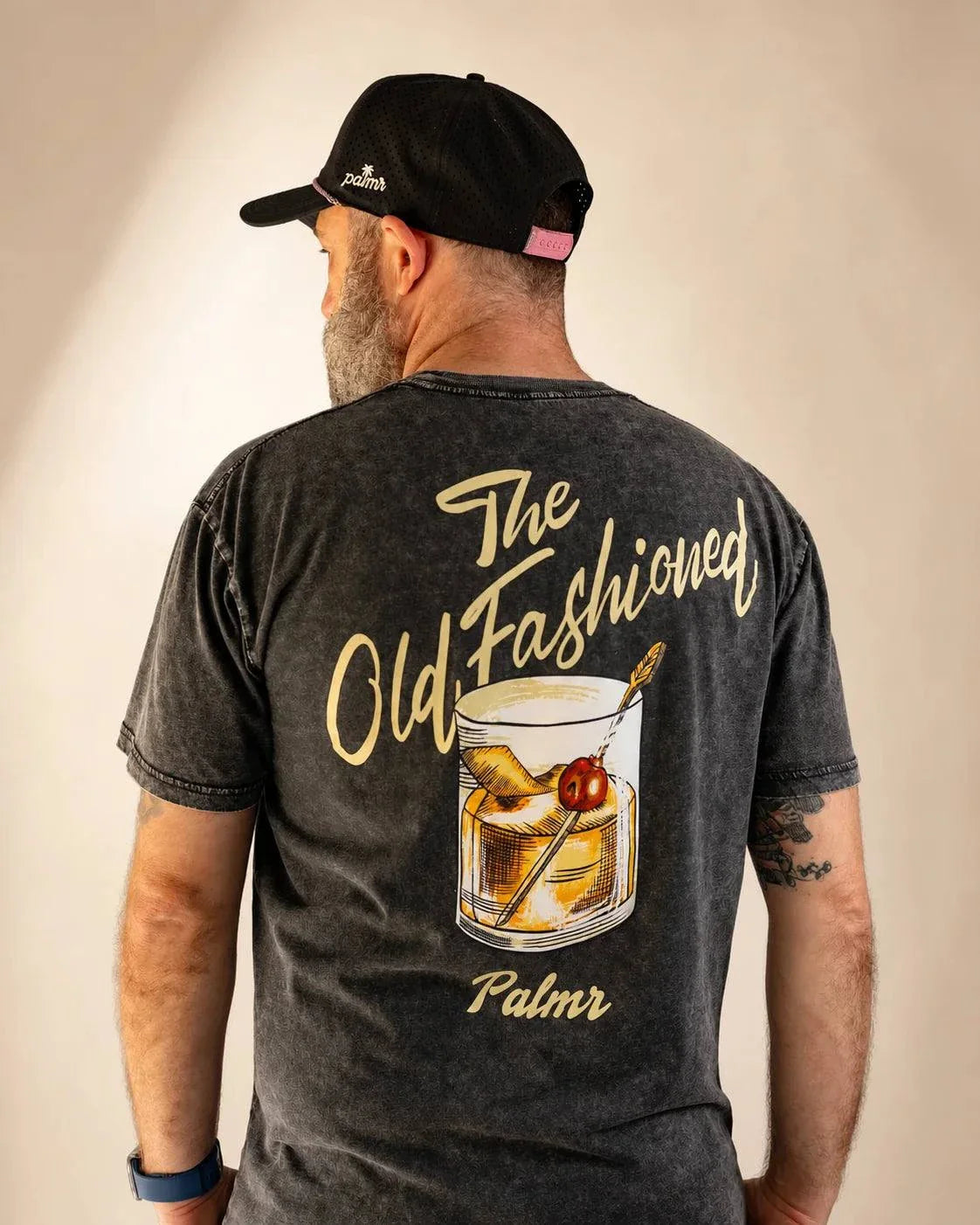 Stone-washed Old Fashioned Tee with cream palm and cocktail illustration on back, 100% combed cotton, casual fit
