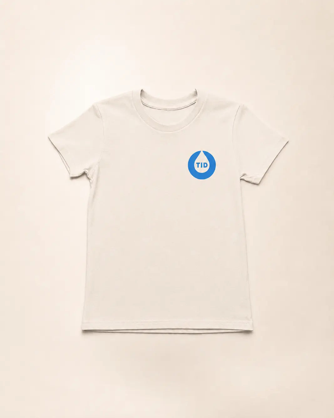 Beige t-shirt with a blue T1D logo on a beige background