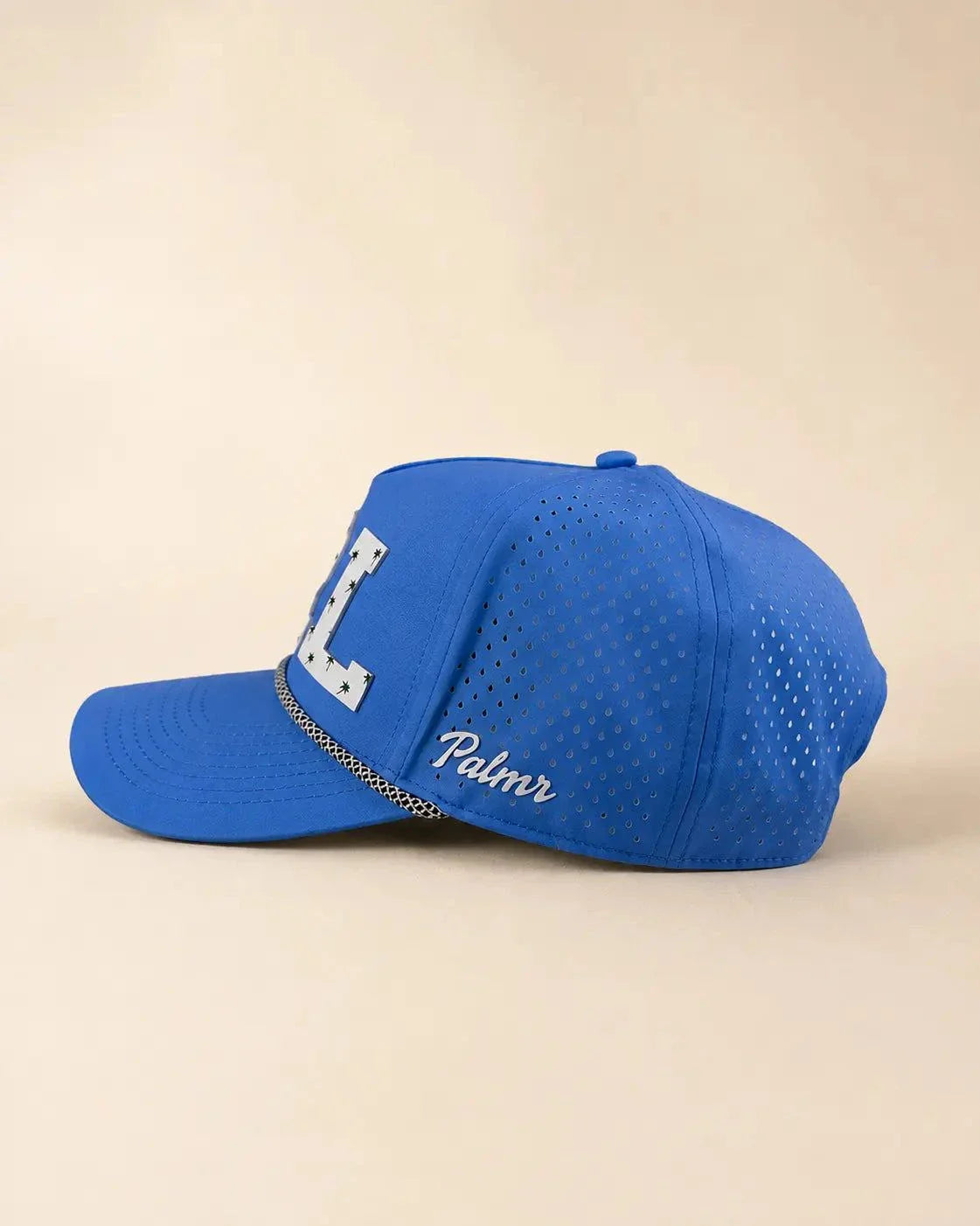 Blue ORL Signature Hat with white silicone Orlando letters and palm design, water-resistant and breathable The 407 Hat