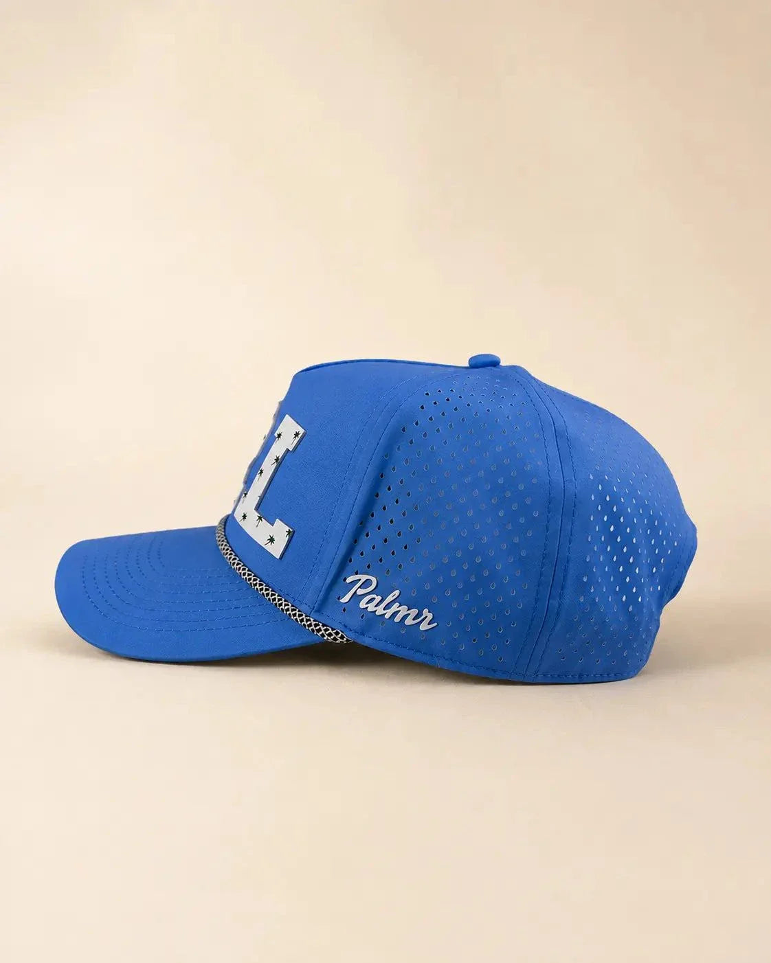 Blue ORL Signature Hat with white silicone Orlando letters and palm design, water-resistant and breathable The 407 Hat