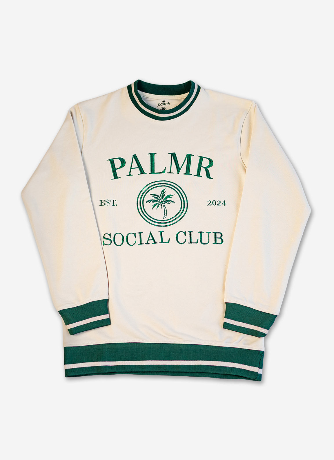 Cream-colored sweatshirt with green accents and 'Palmer Social Club' text on a white background