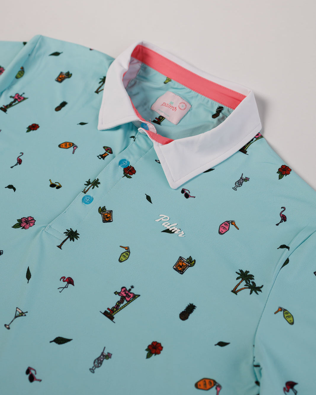 Light blue polo shirt with colorful pattern on a white background