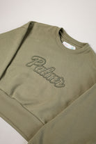 Olive green sweatshirt with 'Palmr' embroidery on a light gray background