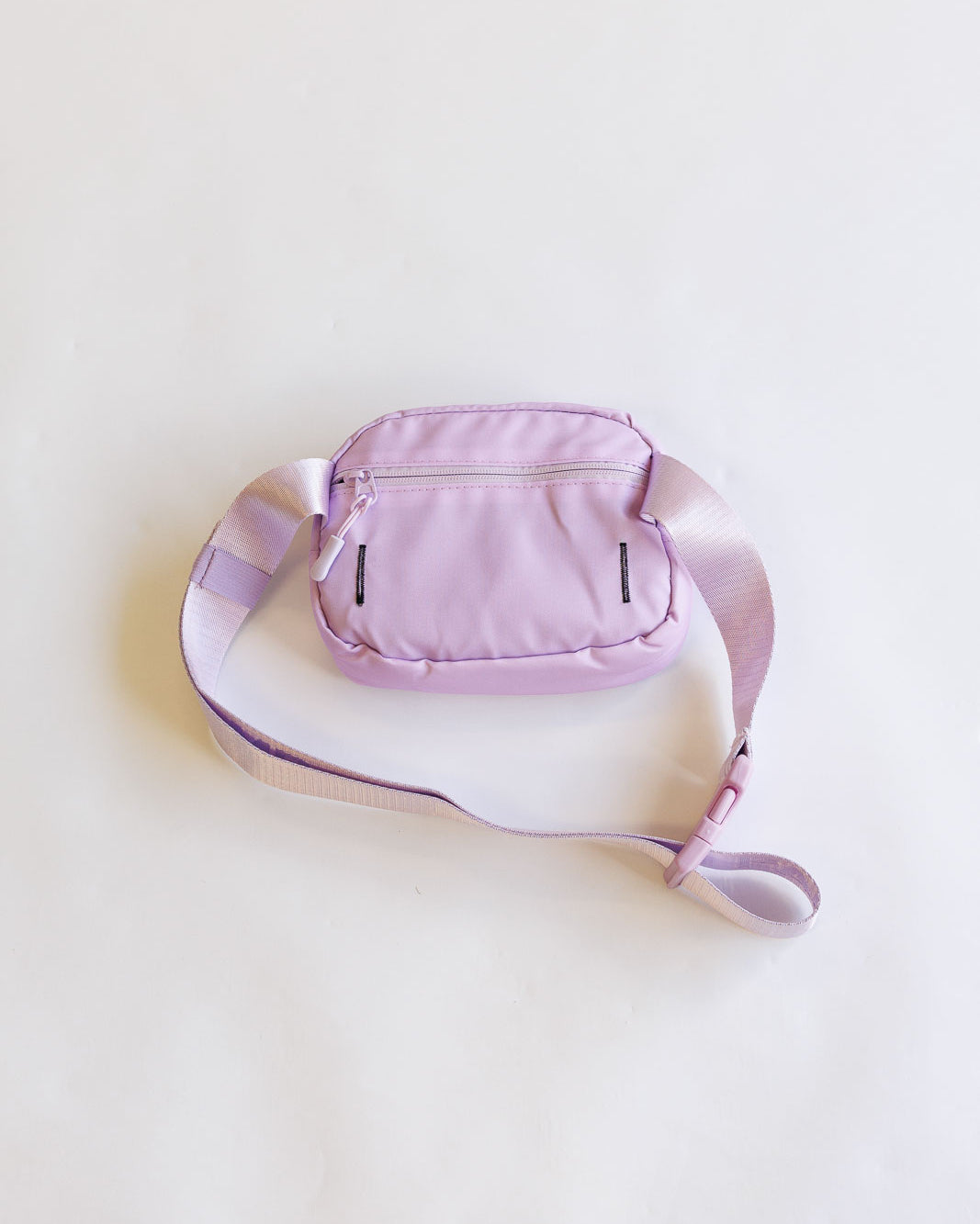 Pink waist bag on a light beige background