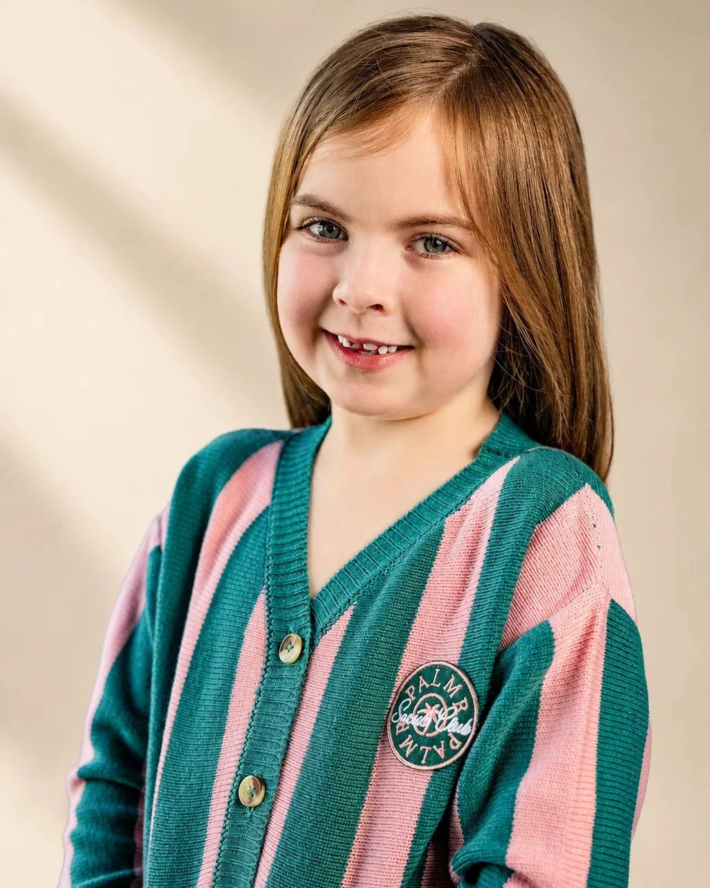 Pink and green striped Palm of My Heart Girls Cardigan with embroidered patch and front pockets for kids