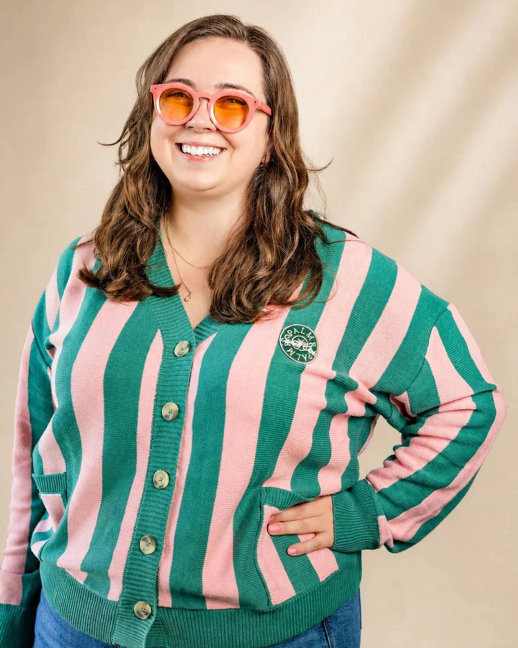 Pink and cream striped Palm of My Heart Cardigan with embroidered patch and front pockets, cozy and polished fit