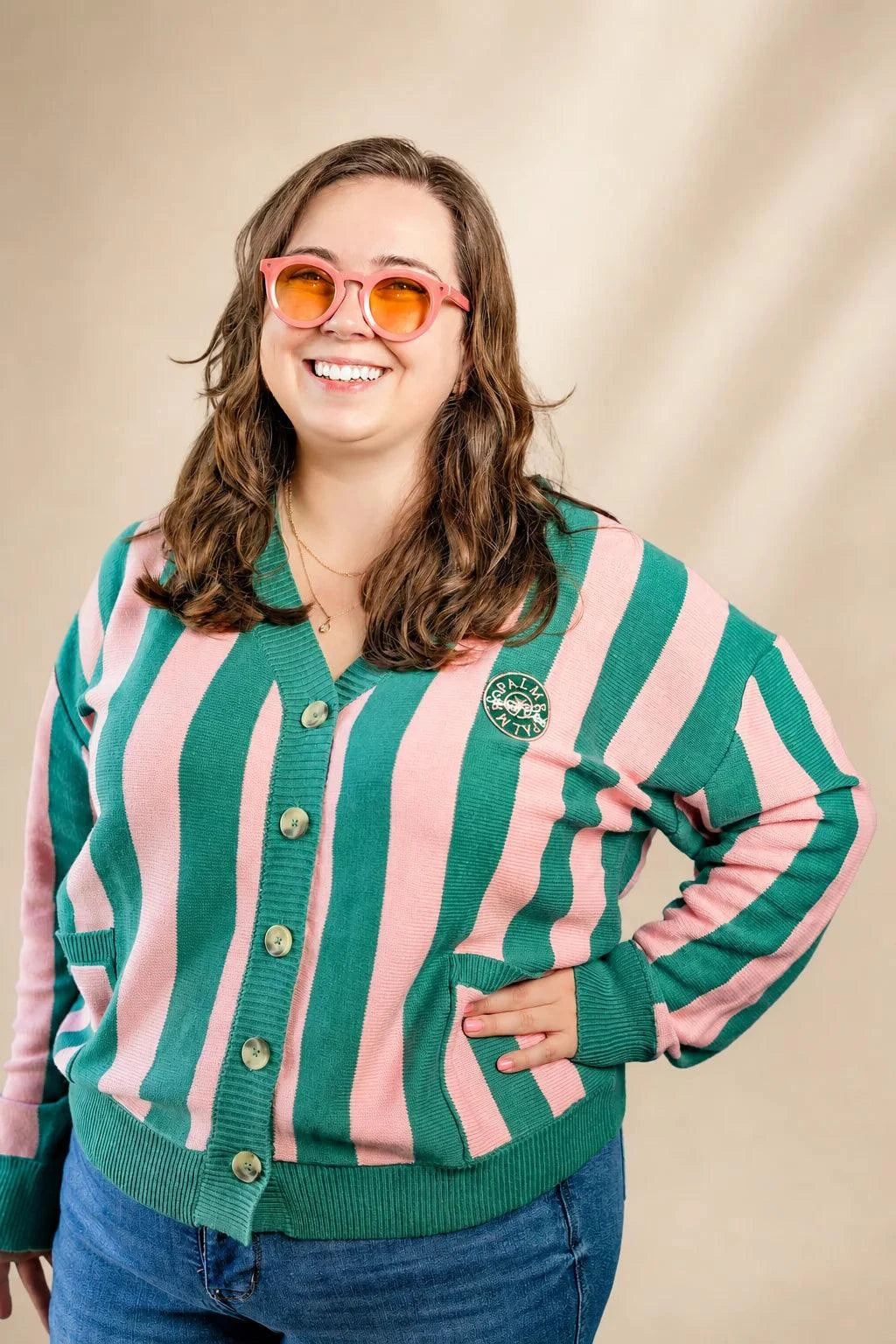 Pink and cream striped Palm of My Heart Cardigan with embroidered patch and front pockets, cozy and polished fit