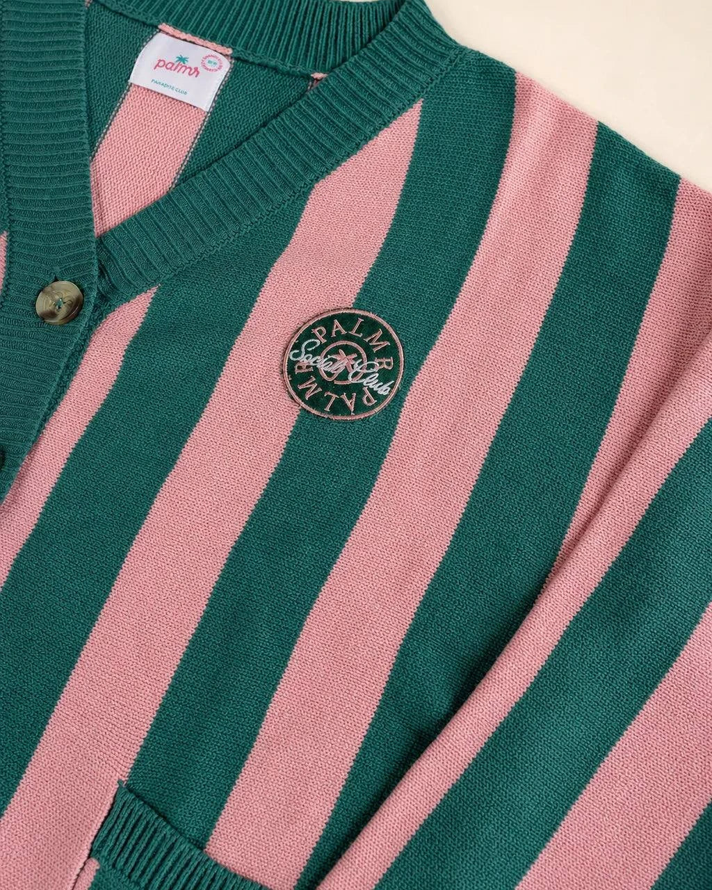 The Palm of My Heart Cardigan in pink and cream stripes with embroidered patch and front pockets, cozy and polished knitwear.