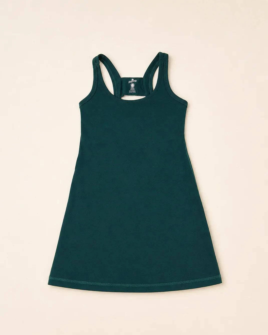 The Ace Kids Dress in palm green with pink and teal palm tree print, pump-friendly shorts with pockets and discreet slits
