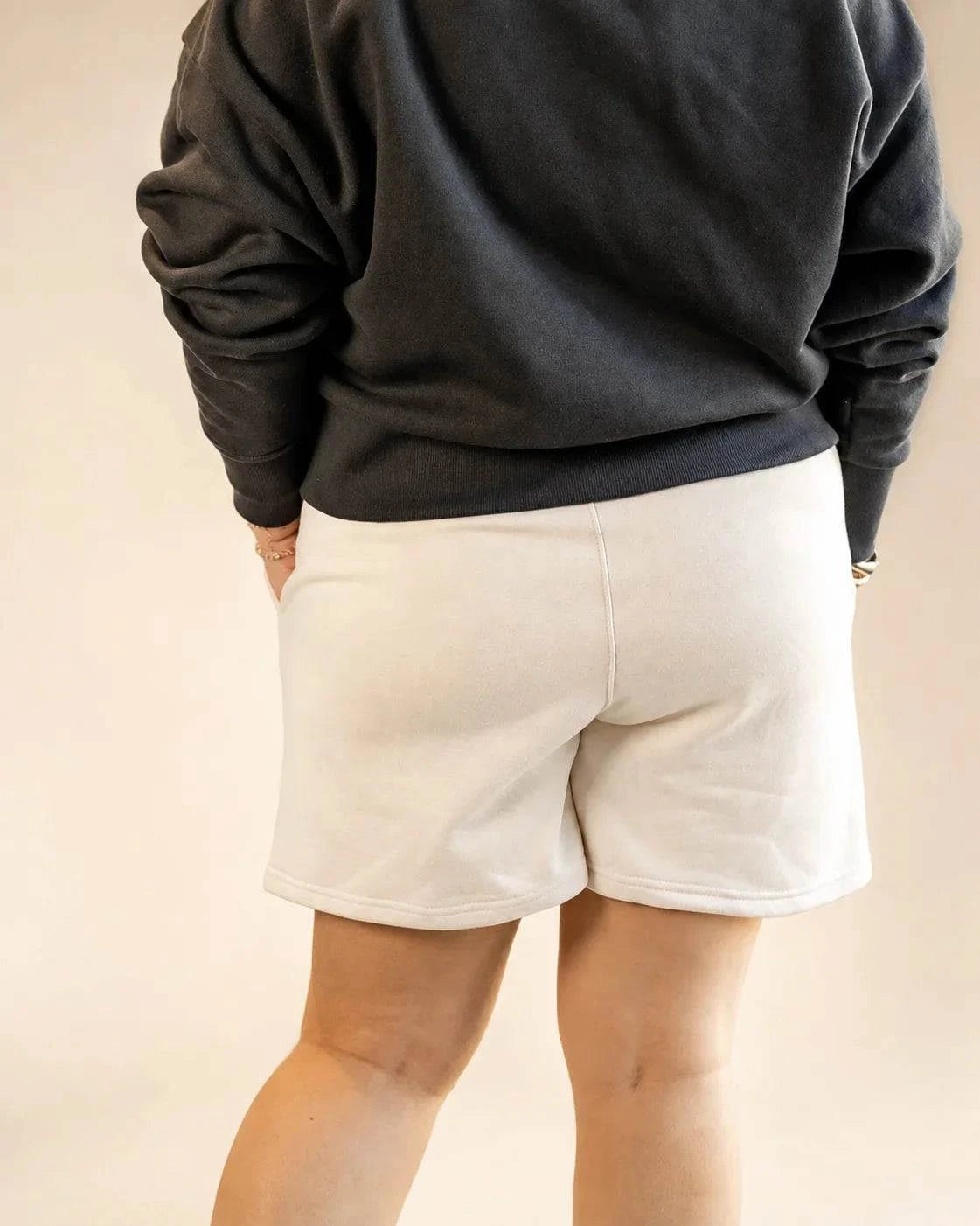 Cream Sandbar Fleece Shorts with high waist and side pockets for casual wear