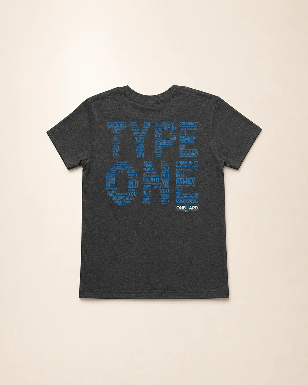 Dark gray t-shirt with blue text on a beige background