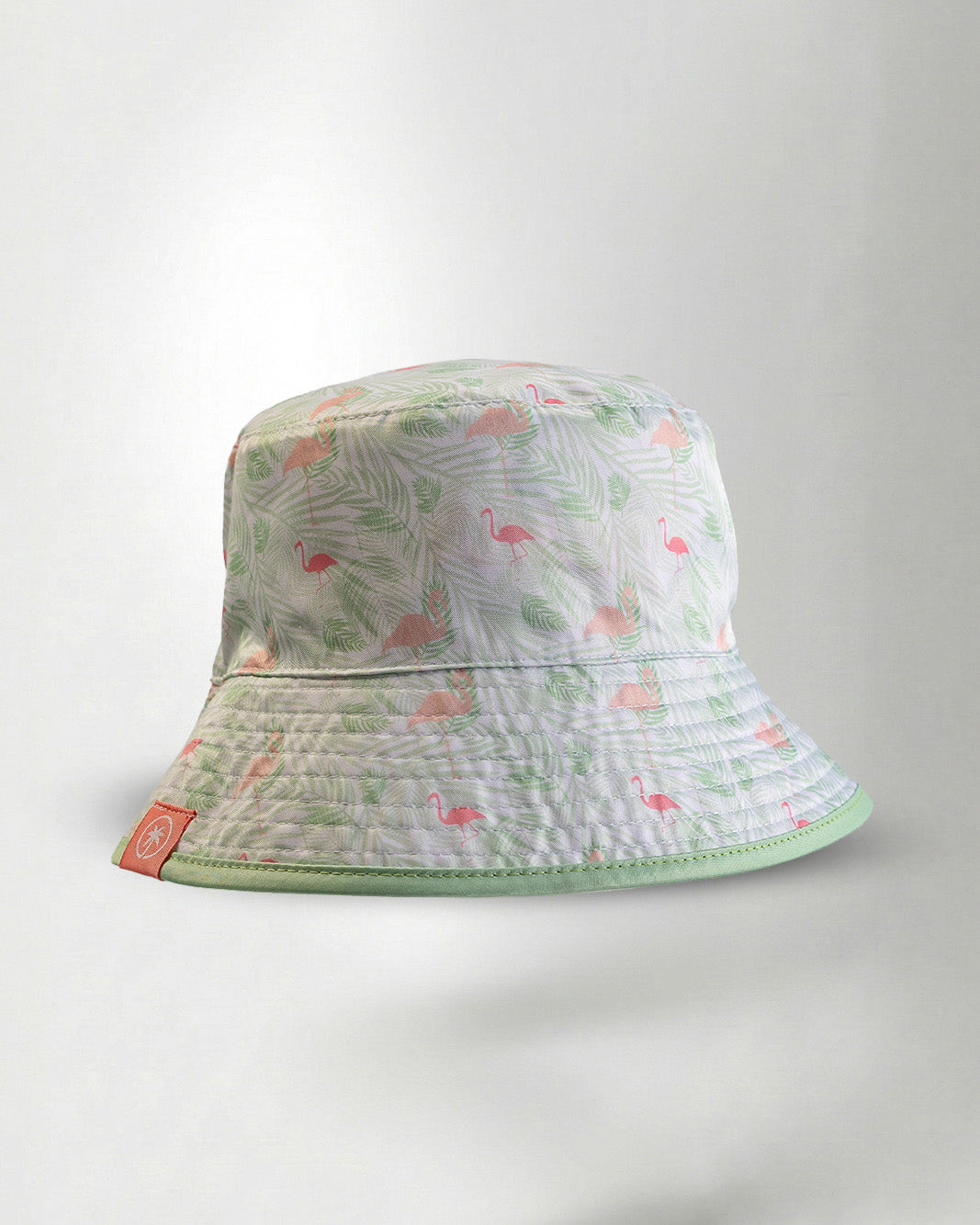 White bucket hat with a color tropical pattern.