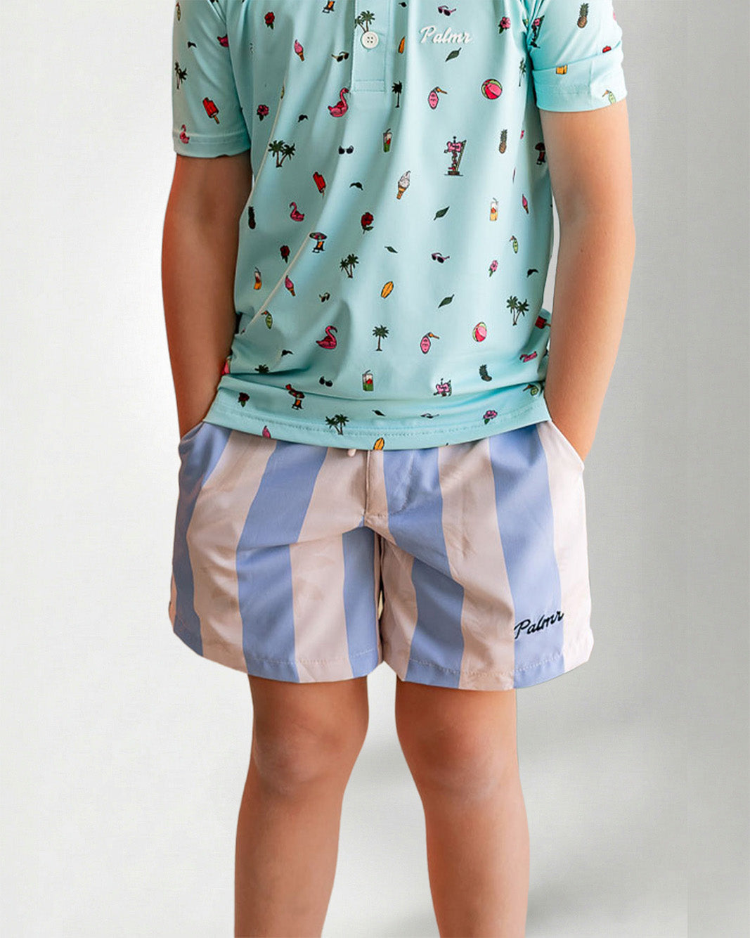 Person wearing striped shorts with "Palmr" embroidery