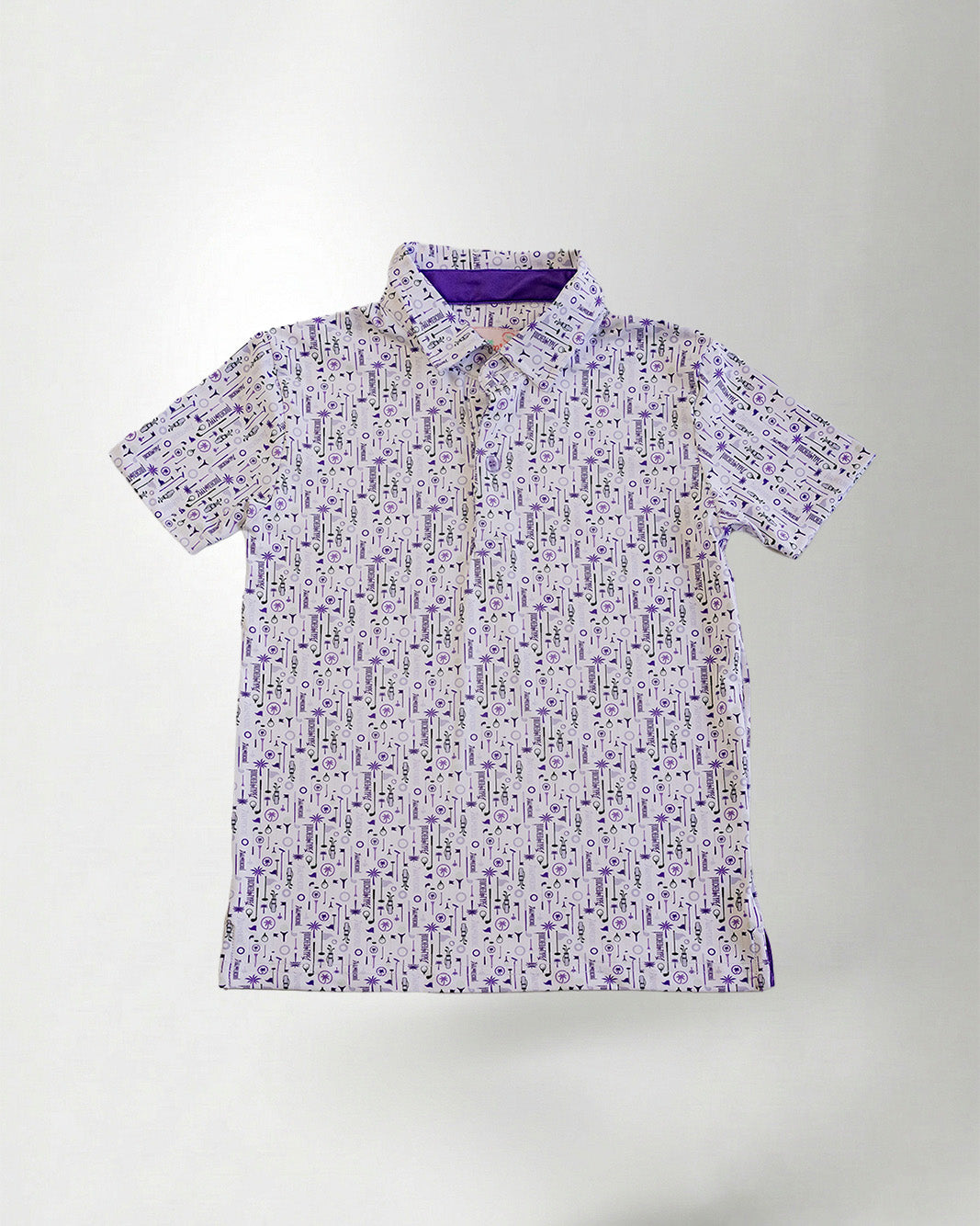 Patterned shirt and blue cap against a plain background