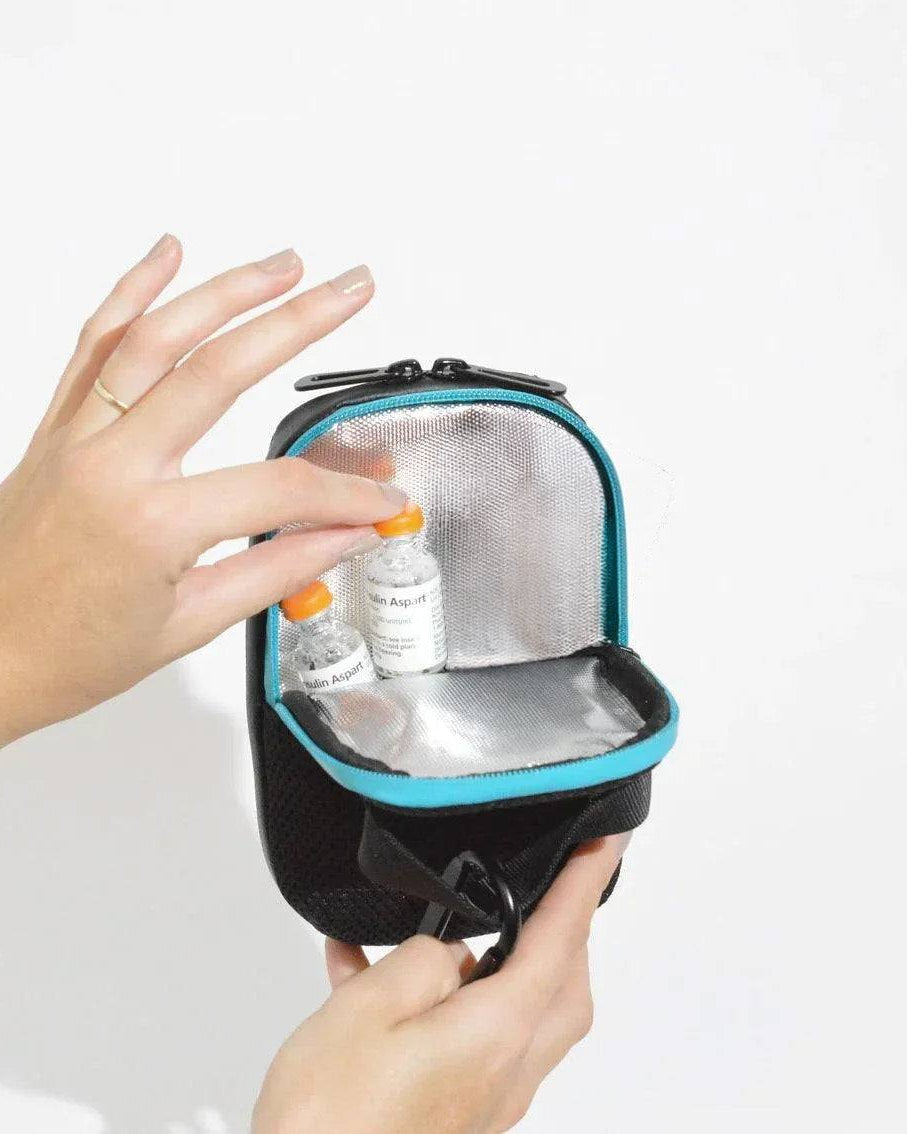 Compact insulated crossbody bag with nylon strap and carabiners for diabetes medication storage