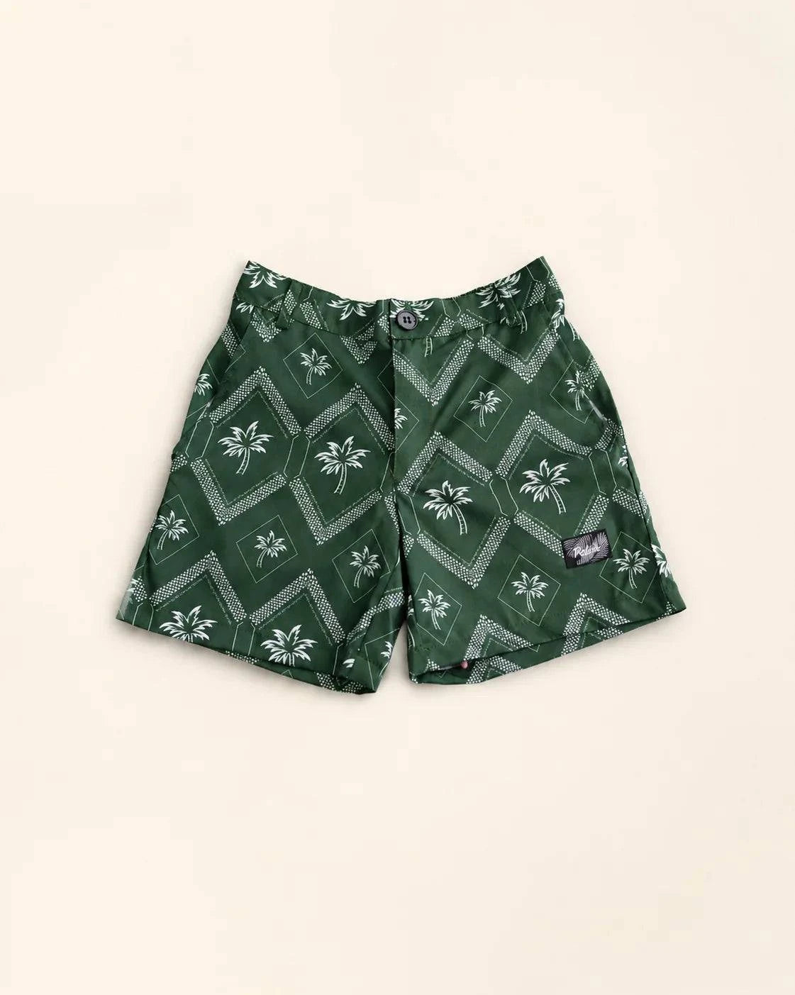 The Club Palm Kids hybrid swim shorts with Palm Green geometric print and zippered pockets for active children