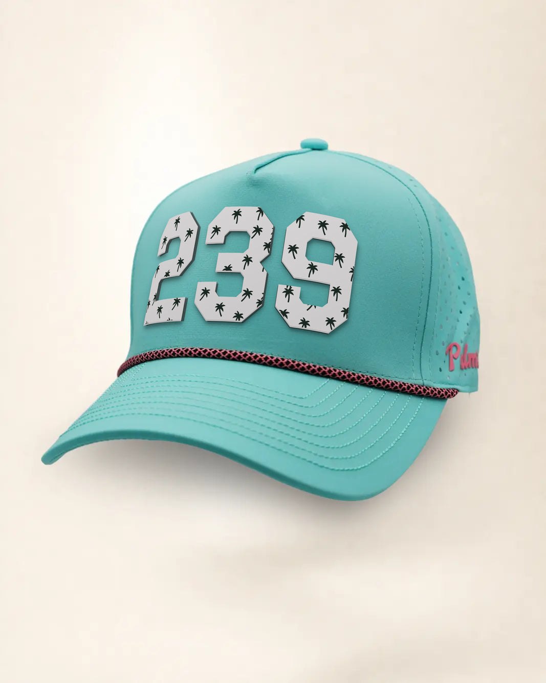 The 239 Signature Hat (Teal), three-quarter view: white raised 239 with small palm print on a teal rope snapback, pink and black rope, pink Palmr script.