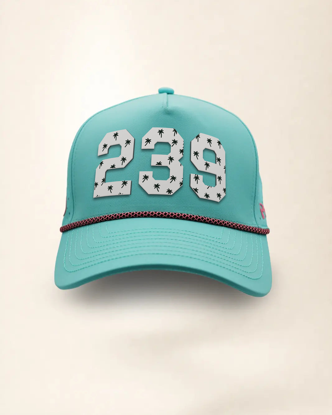 The 239 Signature Hat (Teal), front view: white raised 239 with small palm print on a teal crown, pink and black rope along the brim.