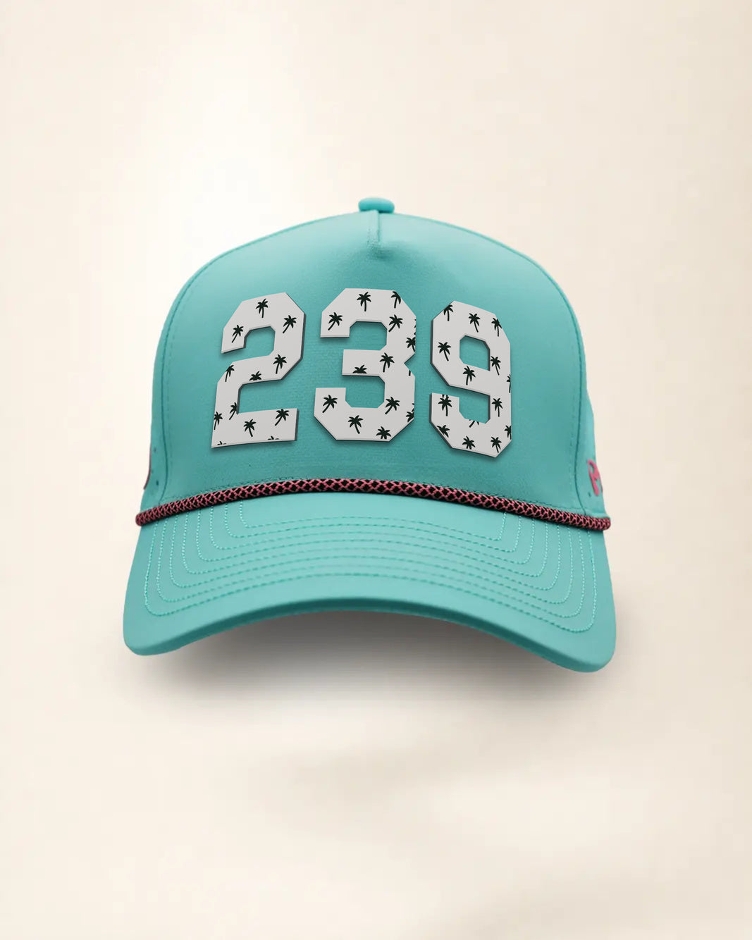 The 239 Signature Hat (Teal), front view: white raised 239 with small palm print on a teal crown, pink and black rope along the brim.