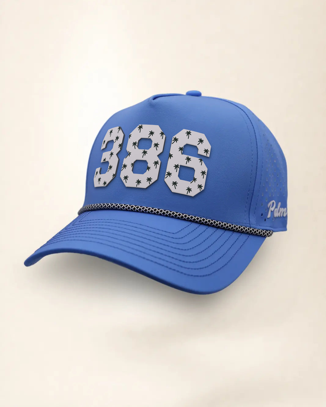 The 386 Signature Hat (Blue), three-quarter view: white raised 386 with small palm print on a blue rope snapback, black and white rope, white Palmr script.