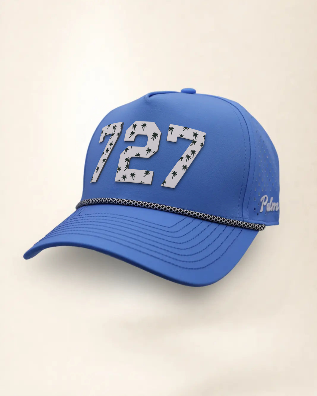 The 727 Signature Hat (Blue), three-quarter view: white raised 727 with small palm print on a blue rope snapback, black and white rope, white Palmr script.