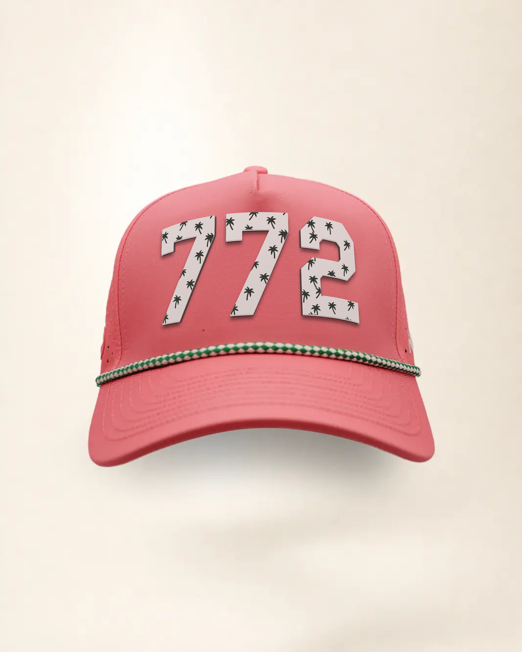 The 772 Signature Hat (Pink), front view: white raised 772 with small palm print on a pink crown, green and white rope along the brim.