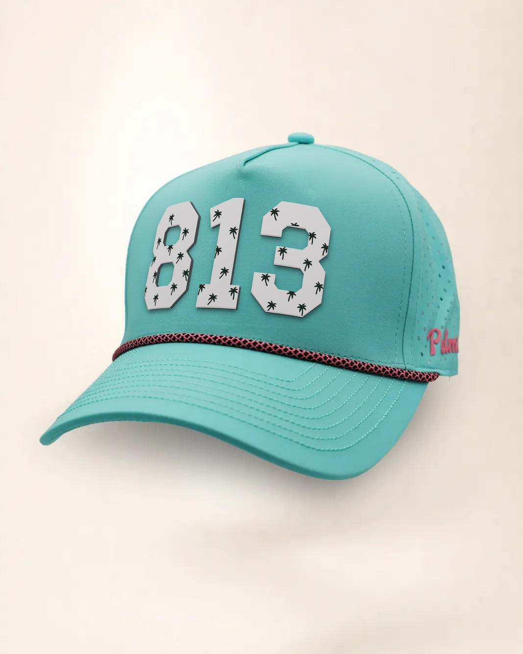 The 813 Signature Hat (Teal), three-quarter view: white raised 813 with small palm print on a teal rope snapback, pink and black rope, pink Palmr script.