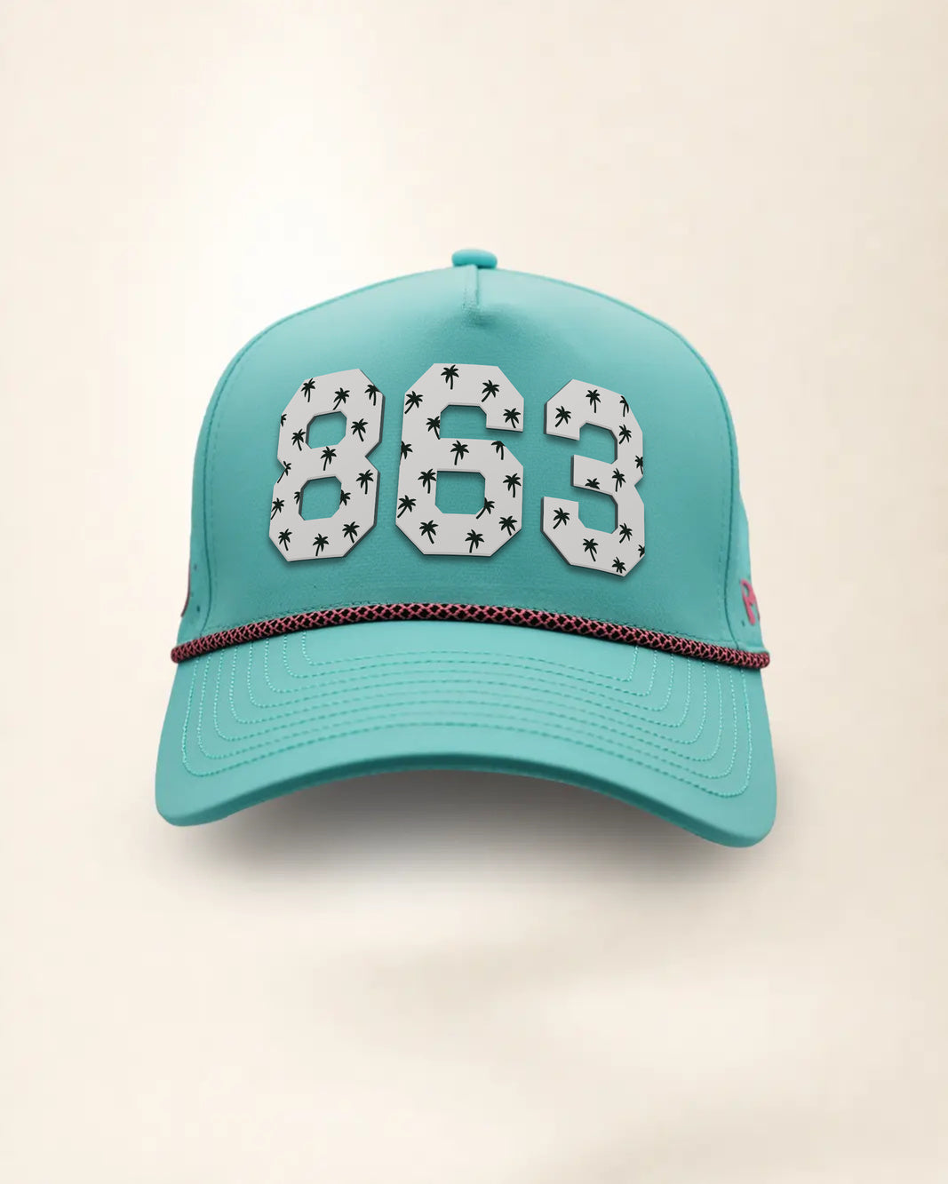 The 863 Signature Hat (Teal), front view: white raised 863 with small palm print on a teal crown, pink and black rope along the brim.